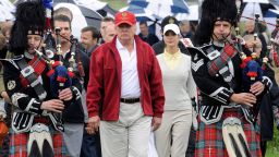 (FILES) A picture taken on July 10, 2012 shows US tycoon Donald Trump (C) escorted by Scottish pipers as he officially opens his new multi-million pound Trump International Golf Links course in Aberdeenshire, Scotland. Over 70,000 people had on December 9, 2015 signed a petition to ban US presidential hopeful Donald Trump from entering Britain following his call to bar Muslims from entering the United States.
AFP PHOTO / Andy BuchananAndy Buchanan/AFP/Getty Images