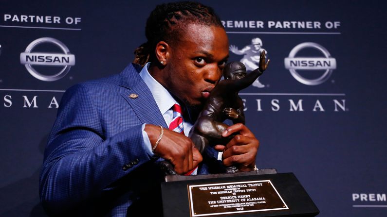 Alabama running back Derrick Henry kisses <a href="index.php?page=&url=http%3A%2F%2Fwww.cnn.com%2F2015%2F12%2F12%2Fus%2Fheisman-trophy%2F" target="_blank">his Heisman Trophy</a> on Saturday, December 12. Henry rushed for 1,986 yards this season, breaking Herschel Walker's SEC record.