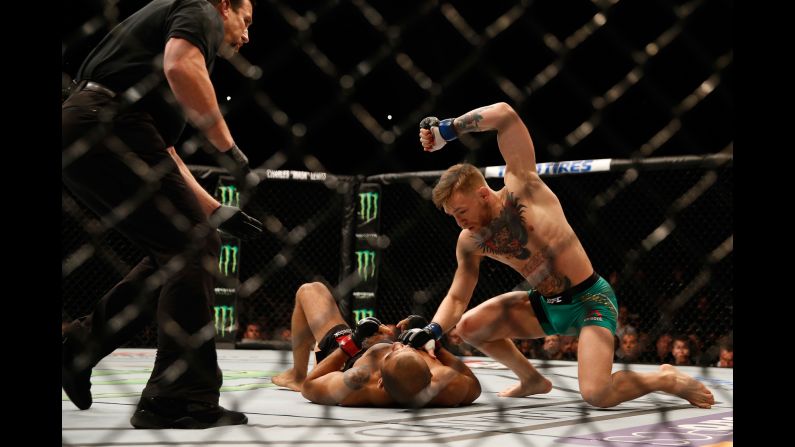 Conor McGregor punches Jose Aldo during their <a href="index.php?page=&url=http%3A%2F%2Fbleacherreport.com%2Farticles%2F2598679-ufc-194-results-technical-breakdown-of-aldo-mcgregor-and-weidman-rockhold" target="_blank" target="_blank">UFC featherweight title fight</a> in Las Vegas on Saturday, December 12. McGregor knocked Aldo out in 13 seconds -- a UFC record for a title fight -- handing the champion his first loss in 10 years. 