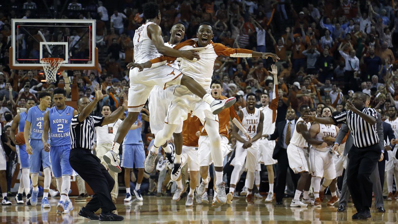 Texas basketball players celebrate after a buzzer-beater by Javan Felix gave them an 84-82 victory over North Carolina on Saturday, December 12.