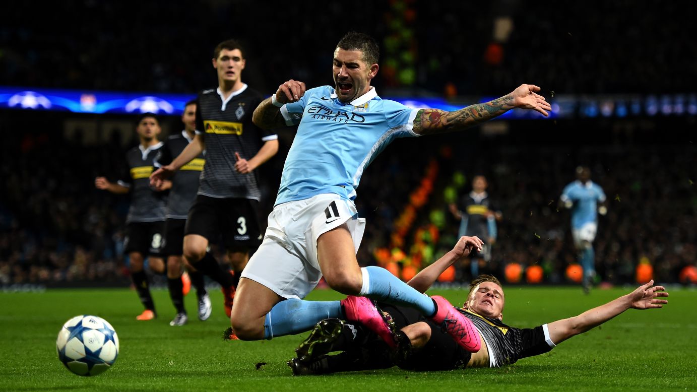 Manchester City's Aleksandar Kolarov is tackled by Nico Elvedi of Borussia Moenchengladbach during a Champions League match in Manchester, England, on Tuesday, December 8.