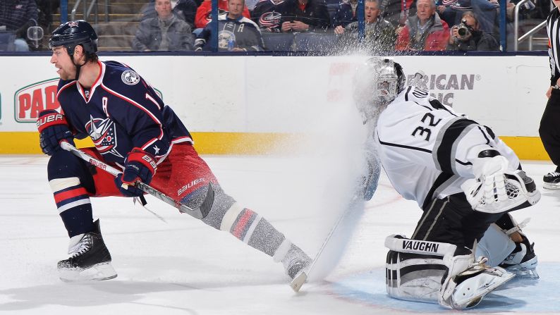 Columbus forward Brandon Dubinsky sprays ice into the face of Los Angeles goaltender Jonathan Quick during an NHL game in Columbus, Ohio, on Tuesday, December 8.