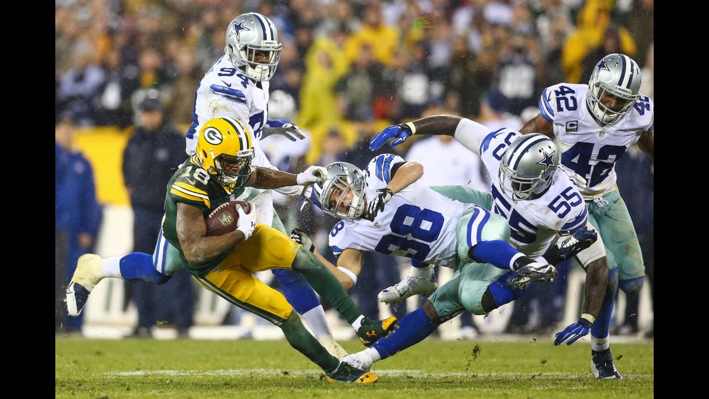 Dallas' Jeff Heath (No. 38) collides with Green Bay's Randall Cobb during an NFL game in Green Bay, Wisconsin, on Sunday, December 13.