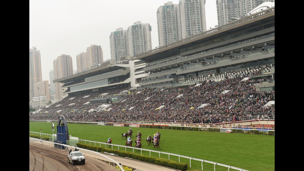 Horses race at the Sha Tin Racecourse in Hong Kong on Sunday, December 13.