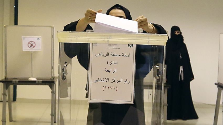 A Saudi woman casts her ballot at a polling center during municipal elections, in Riyadh, Saudi Arabia, Saturday, Dec. 12, 2015. Saudi women are heading to polling stations across the kingdom on Saturday, both as voters and candidates for the first time in this landmark election. (AP Photo/Aya Batrawy)