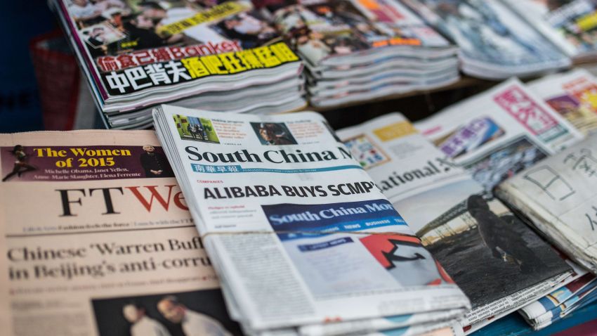 A copy (C) of the South China Morning Post (SCMP) is displayed at a newsstand in Hong Kong on December 12, 2015, following its acquisition by Chinese internet giant Alibaba of the English-language newspaper. Alibaba said on December 11 it would buy Hong Kong's South China Morning Post, pledging to maintain the newspaper's objectivity in the face of fears it will lose its independent voice.   AFP PHOTO / ANTHONY WALLACEANTHONY WALLACE/AFP/Getty Images