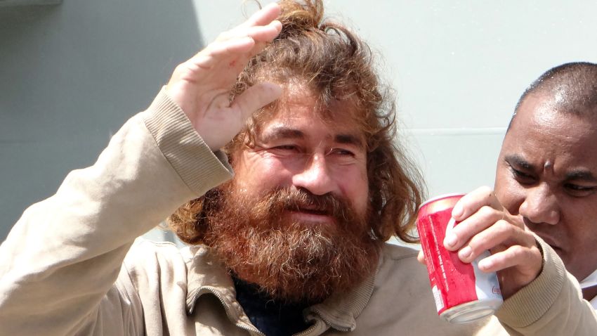 A Salvadorean castaway who identified himself as Jose Ivan and later told that his full name is Jose Salvador Alvarenga walks with the help of a Majuro Hospital nurse in Majuro after a 22-hour boat ride from isolated Ebon Atoll on February 3, 2014. Jose was washed up on Ebon Atoll on January 30, 2014, and told his rescuers he set sail from Mexico for El Salvador in September 2012 and has been floating on the ocean ever since.    AFP PHOTO / Hilary Hosia        (Photo credit should read HILARY HOSIA/AFP/Getty Images)
