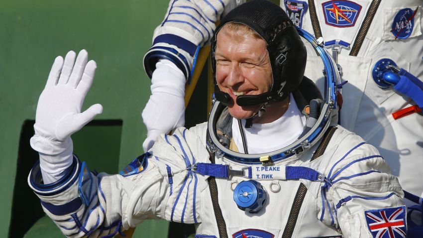 Britain's astronaut Tim Peake waves as he boards the Soyuz TMA-19M spacecraft at the Russian-leased Baikonur cosmodrome, prior to blasting off to the International Space Station (ISS), on December 15, 2015. Russia's Soyuz TMA-19M spacecraft carrying the International Space Station (ISS) Expedition 46/47 crew of Britain's astronaut Tim Peake, Russian cosmonaut Yuri Malenchenko and US astronaut Tim Kopra is scheduled to blast off to the ISS on December 15, 2015.  AFP PHOTO / POOL / SHAMIL ZHUMATOV / AFP / POOL / SHAMIL ZHUMATOV        (Photo credit should read SHAMIL ZHUMATOV/AFP/Getty Images)