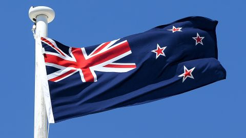 The current New Zealand flag features the Union Jack and four stars representing the Southern Cross.
