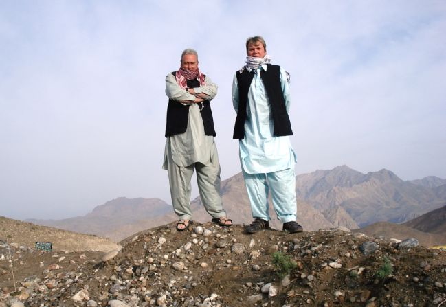 2009: Drury and cousin Green wear local outfits up a mountain in Tora Bora, Afghanistan -- once thought to be the hiding place of Al Qaeda leader Osama bin Laden.