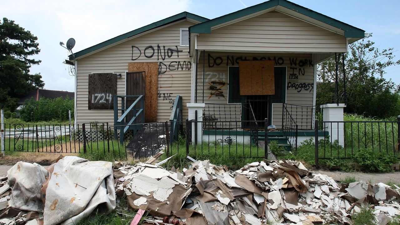 A damaged home painted with the words "Do Not Demo" stands amid debris in 2007 in the Lower Ninth Ward.
