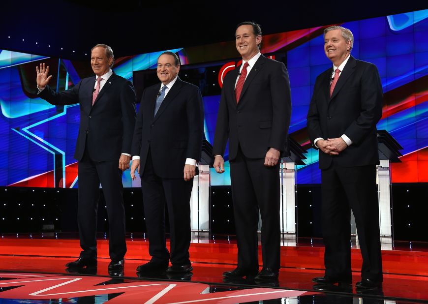 Four Republican presidential candidates take the stage for the "undercard" debate featuring lower-polling candidates. From left are former New York Gov. George Pataki, former Arkansas Gov. Mike Huckabee, former U.S. Sen. Rick Santorum and U.S. Sen. Lindsey Graham.