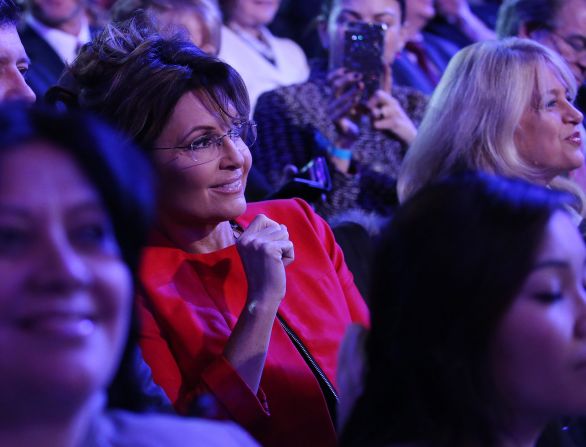Former Alaska Gov. Sarah Palin -- Sen. John McCain's running mate in 2008 -- watches the debate from the audience.