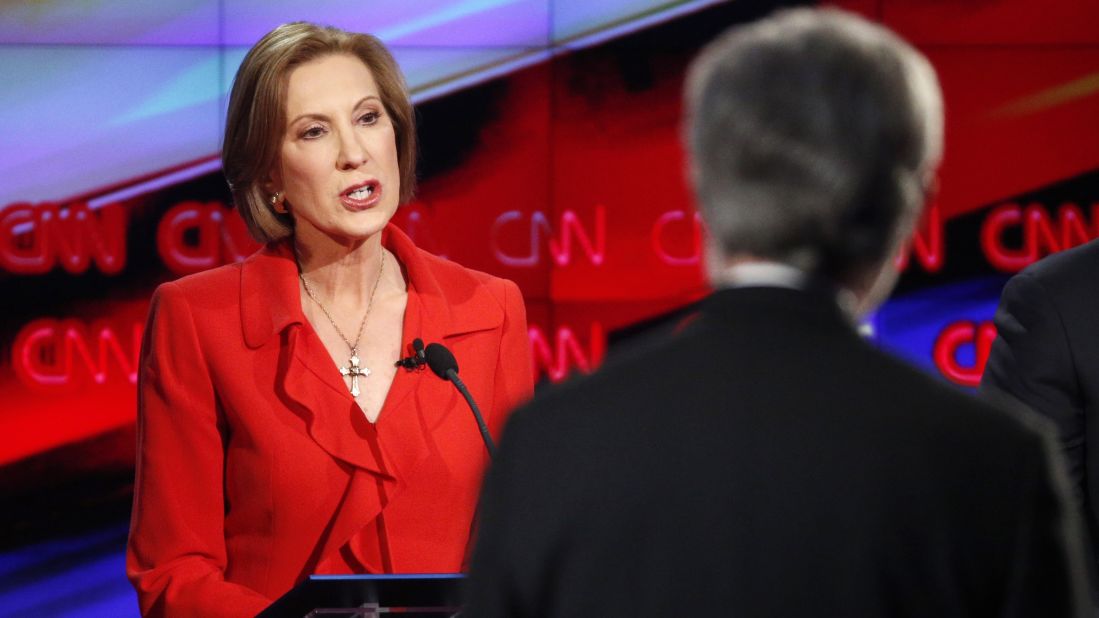Businesswoman Carly Fiorina, left, responds to a question from debate moderator Wolf Blitzer. In her opening remarks, Fiorina said: "I have been tested. I have beaten breast cancer. I have buried a child. I started as a secretary. I fought my way to the top of corporate America while being called every B-word in the book. I fought my way into this election and on to this debate stage while all the political insiders and the pundits told me it couldn't be done."