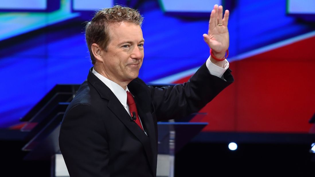 Paul waves as he takes the stage before the start of the debate. "I think we defeat terrorism by showing them that we do not fear them," said the junior U.S. senator from Kentucky. "I think if we ban certain religions, if we censor the Internet, I think that at that point the terrorists will have won."