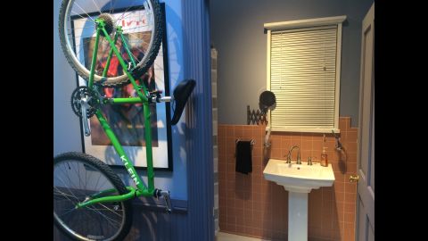 As on the original set, a bicycle hangs in the hallway leading to Jerry's bathroom and bedroom.