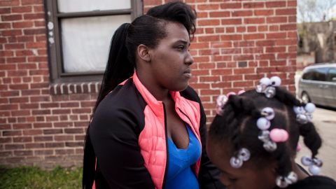 Kiona Mack sits on the ledge where Gray was arrested in the Gilmor Homes public housing projects. Mack recorded the <a href="http://www.cnn.com/videos/tv/2015/04/23/ac-marquez-new-video-of-freddie-gray-arrest.cnn" target="_blank">first video of Gray's arrest</a> to go viral. You can hear her in the video yelling "his leg is broken." Since her friend's death she has taken on a leadership role in the community, organizing vigils and protests.