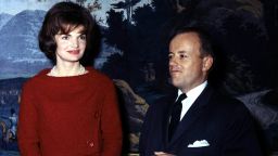 First Lady Jacqueline Kennedy poses for a photograph with James Hoban Alexander at the White House December 5, 1961 in Washington, DC.