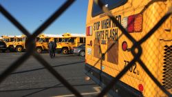 Los Angeles Unified School District buses stand idle in Gardena, Calif., on Tuesday, Dec. 15, 2015.  All Los Angeles area public schools were shut down Tuesday after a after a school board member received an emailed threat that raised fears of another attack like the deadly shooting in nearby San Bernardino. (AP Photo/Damian Dovarganes)