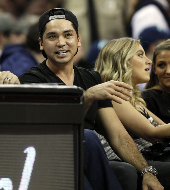 Golf's world No. 2 and his wife were sitting courtside to watch the Cleveland Cavaliers take on Oklahoma City Thunder.
