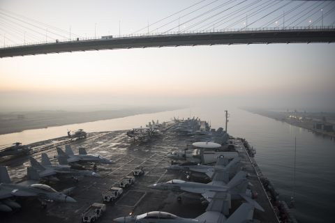 The aircraft carrier USS Harry S. Truman (CVN 75) passes under the Friendship Bridge while transiting the Suez Canal on Dec. 14, 2015. The ship is conducting operations in the Persian Gulf, where Iran claims to have taken footage of the carrier using a drone. Click through the gallery for more images of U.S. Navy aircraft carriers.