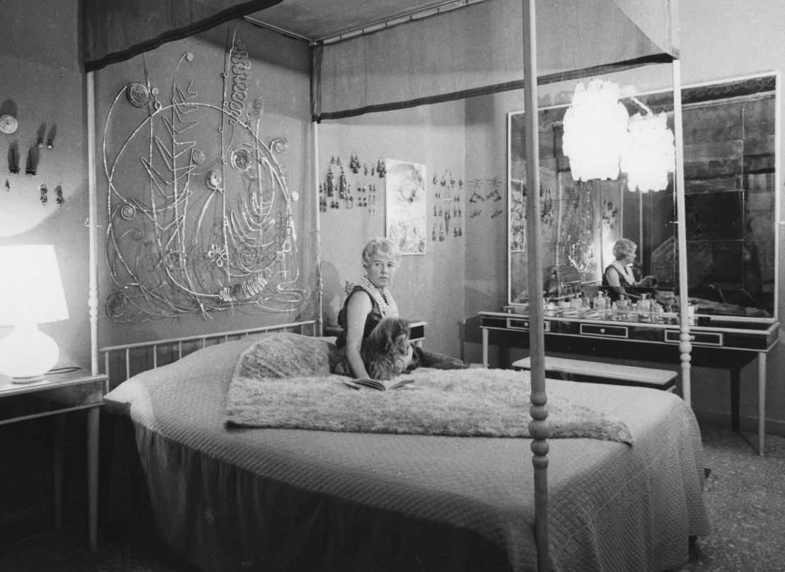 Peggy Guggenheim in her Venice palazzo. Behind her is an Alexander Calder bed head, comissioned by Guggenheim.