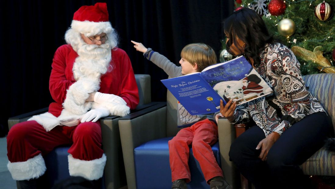 Stephen Orzechowski, 6, points to Santa Claus as first lady Michelle Obama reads "The Night Before Christmas" to children in Washington on Monday, December 14.