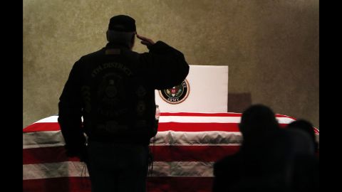 A man salutes the casket of Vietnam veteran James Beavers before his funeral in Fort Wayne, Indiana, on Thursday, December 17. Beavers had no known family or friends to direct the handling of his remains. But hundreds of veterans, military members and everyday citizens attended the service and paid their respects during his funeral.