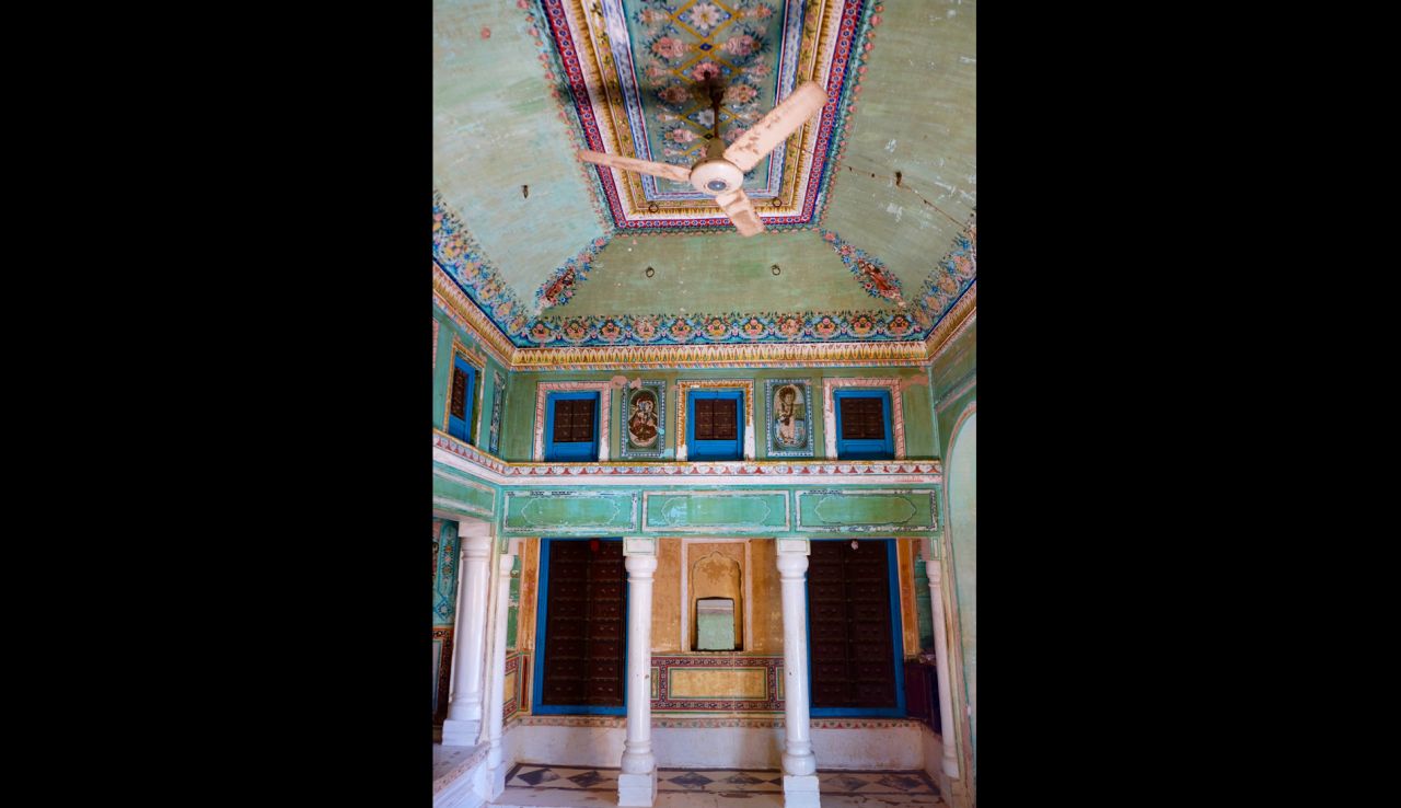 There's no room for wallpaper in a building where paintings cover the interior from ceiling to floor. The common room here was once used to conduct business at Snehi Ram Ladia Haveli.