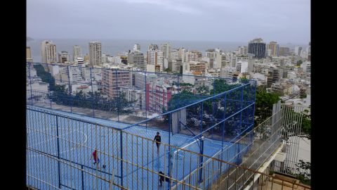 Men play soccer in the Cantagalo favela. Rio will host the 2016 Olympic Games.