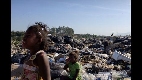 Two young girls are seen in Jardim Gramacho. While it was in operation, it was one of the largest landfills in the world.