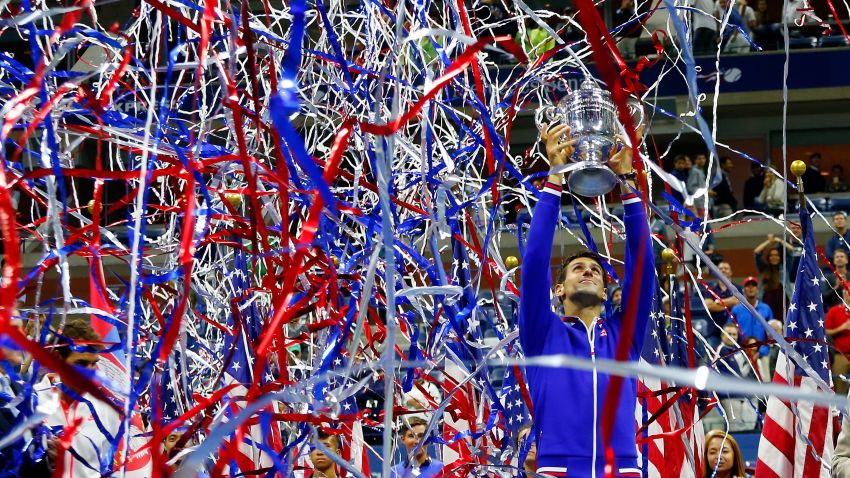 NEW YORK, NY - SEPTEMBER 13:  Novak Djokovic of Serbia celebrates with the trophy after defeating Roger Federer of Switzerland during their Men's Singles Final match on Day Fourteen of the 2015 U.S. Open at the USTA Billie Jean King National Tennis Center on September 13, 2015 in the Flushing neighborhood of the Queens borough of New York City.  (Photo by Mike Stobe/Getty Images for the USTA)