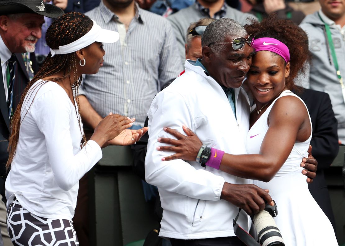 Serena Williams celebrates with her father, Richard Williams, and sister, Venus Williams, after the Wimbledon singles final match against Agnieszka Radwanska of Poland on July 7, 2012.