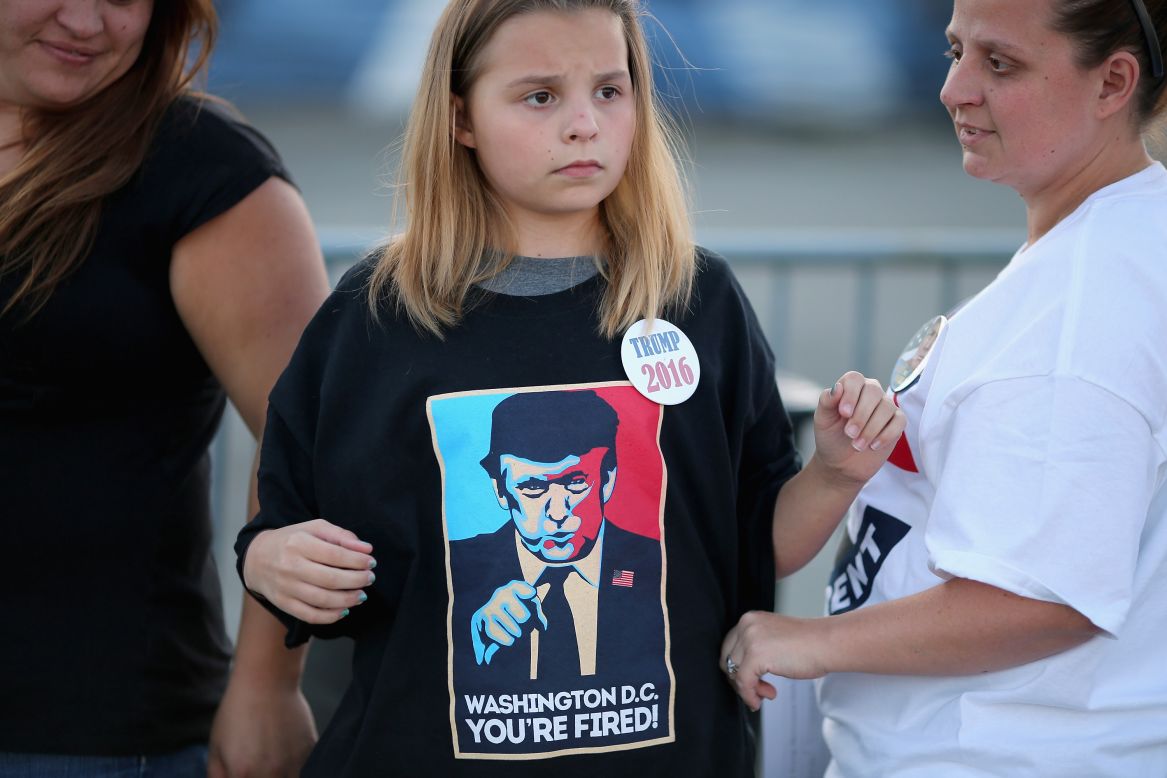 A young woman wears a Trump T-shirt before a rally in Richmond, Virginia, on October 14.