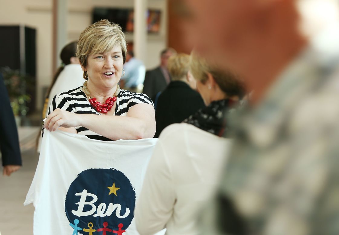 Stacia Taylor holds a T-shirt for Ben Carson at a campaign rally in Sharonville, Ohio, on September 22.