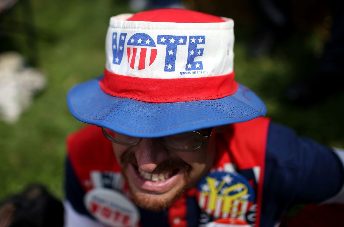 John Olsen wears a patriotic outfit August 13 as he watches former Democratic presidential candidate Jim Webb speak at the Iowa State Fair in Des Moines.