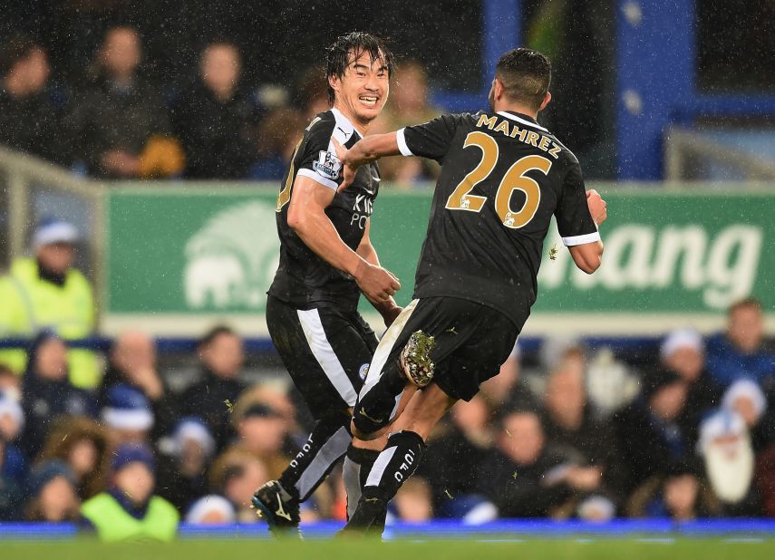 Shinji Okazaki (L) of Leicester City celebrates scoring his team's third goal with his team mate Riyad Mahrez. The Foxes beat Everton 3-2 at Goodison Park. 