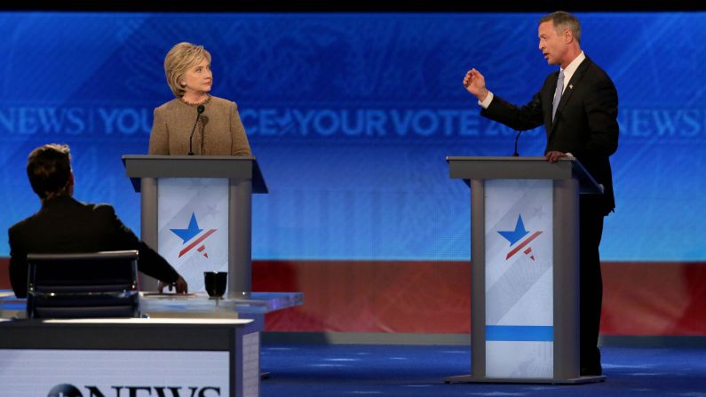 O'Malley speaks during the debate as Clinton looks on.