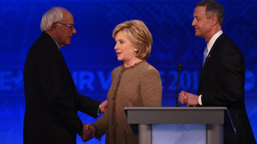 US Democratic presidential hopefuls (L-R) Bernie Sanders, Hillary Clinton and Martin O'Malley greet each other following the Democratic Presidential Debate hosted by ABC News at Saint Anselm College in Manchester, New Hampshire, on December 19, 2015.  