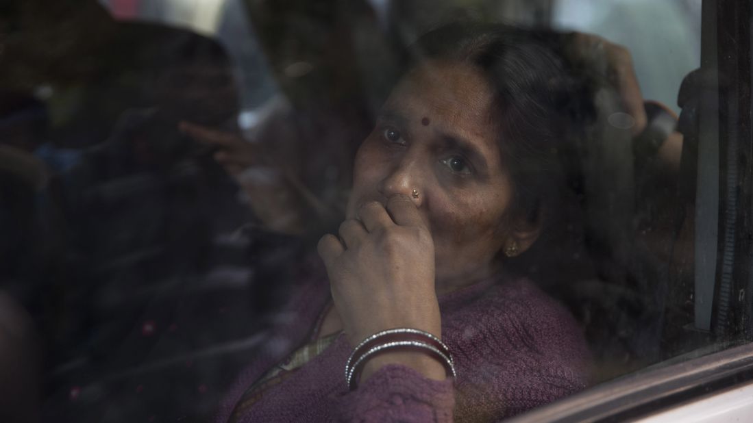 The mother of the victim of the fatal 2012 gang rape that shook the country sits in a car after she arrived to join protesters in New Delhi on Sunday.