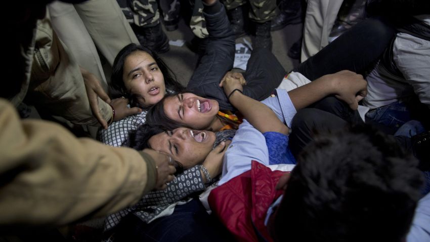 Indian youth shout slogans as they are detained by police during a protest against the release of the juvenile convicted in the fatal 2012 gang rape.