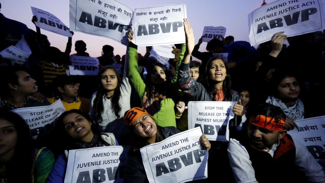 Activists hold signs and shout slogans demanding the death penalty for a convicted rapist during a protest against his release at India Gate in New Delhi on Sunday, December 20, 2015. Because the man was under 18 when the crime occurred, Indian law says he couldn't be given a sentence longer than three years.