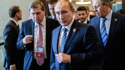 Russian President Vladimir Putin (C) arrives on day two of the G20 Turkey Leaders Summit on November 16, 2015 in Antalya. Putin said on November 16 that the attacks in Paris showed the need for his proposal for an international anti-terror coalition to be realised.