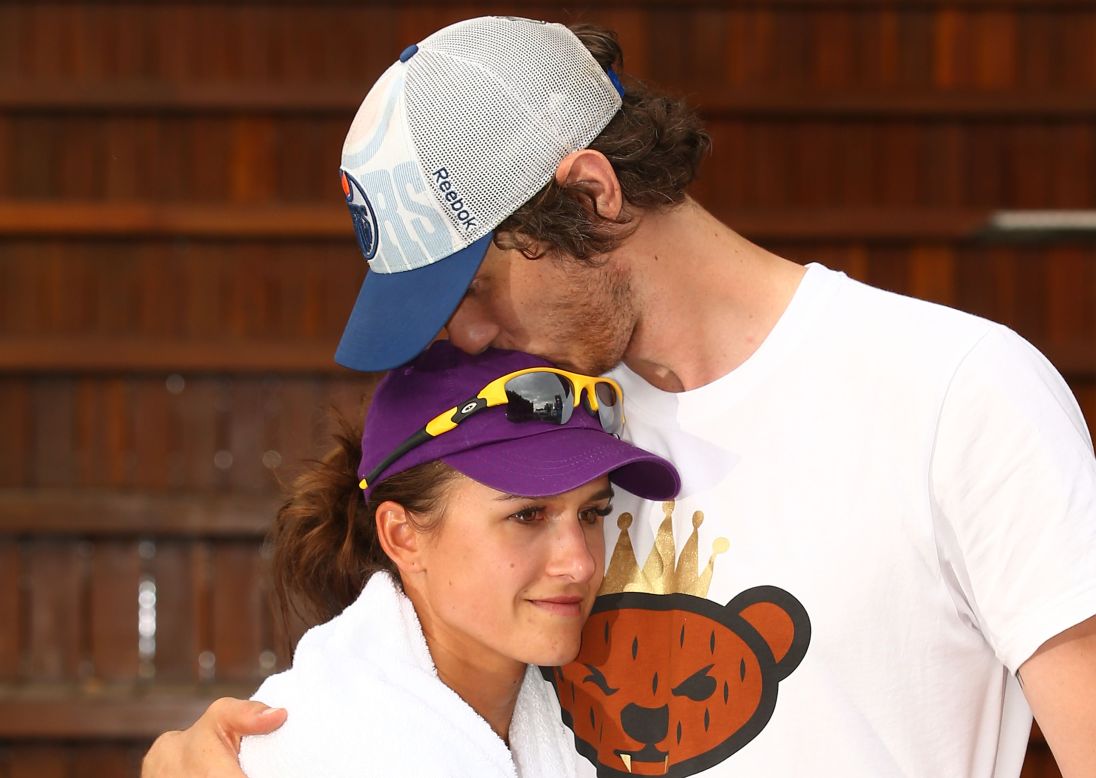 Tennis player Arina Rodionova is consoled by her newly-betrothed, Tyrone Vickery, after losing an Australian Open qualifier the day after their wedding. 