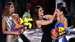 Miss Philippines 2015, Pia Alonzo Wurtzbach (R), reacts as she is crowned the 2015 Miss Universe by 2014 Miss Universe Paulina Vega (C) during the 2015 Miss Universe Pageant at The Axis at Planet Hollywood Resort & Casino on December 20, 2015 in Las Vegas, Nevada. Miss Colombia 2015, Ariadna Gutierrez, was mistakenly named as Miss Universe 2015 instead of First Runner-up.