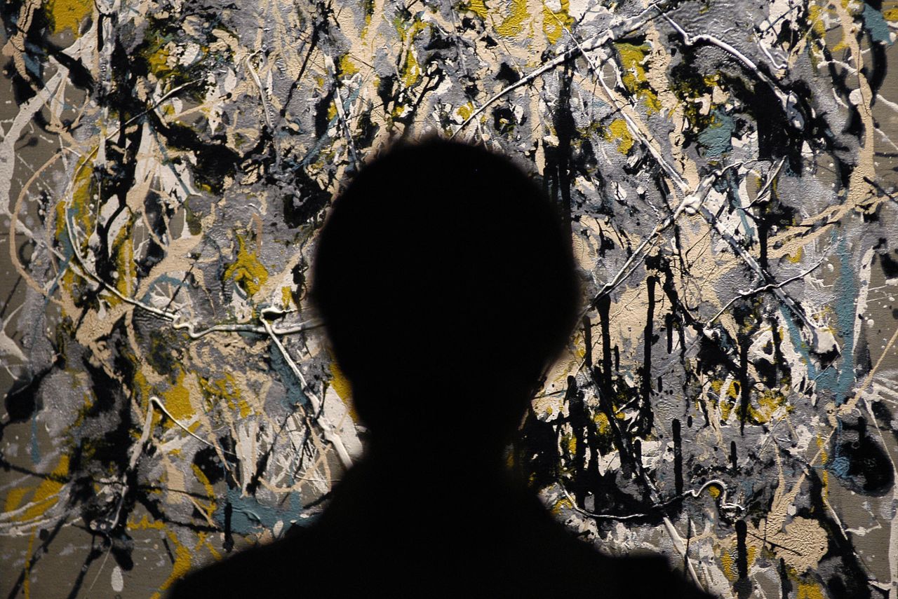 A viewer stands in front of "Autumn Landscape" by Jackson Pollock. Guggenheim claimed her discovery of the New Expressionist was her greatest acheivement.