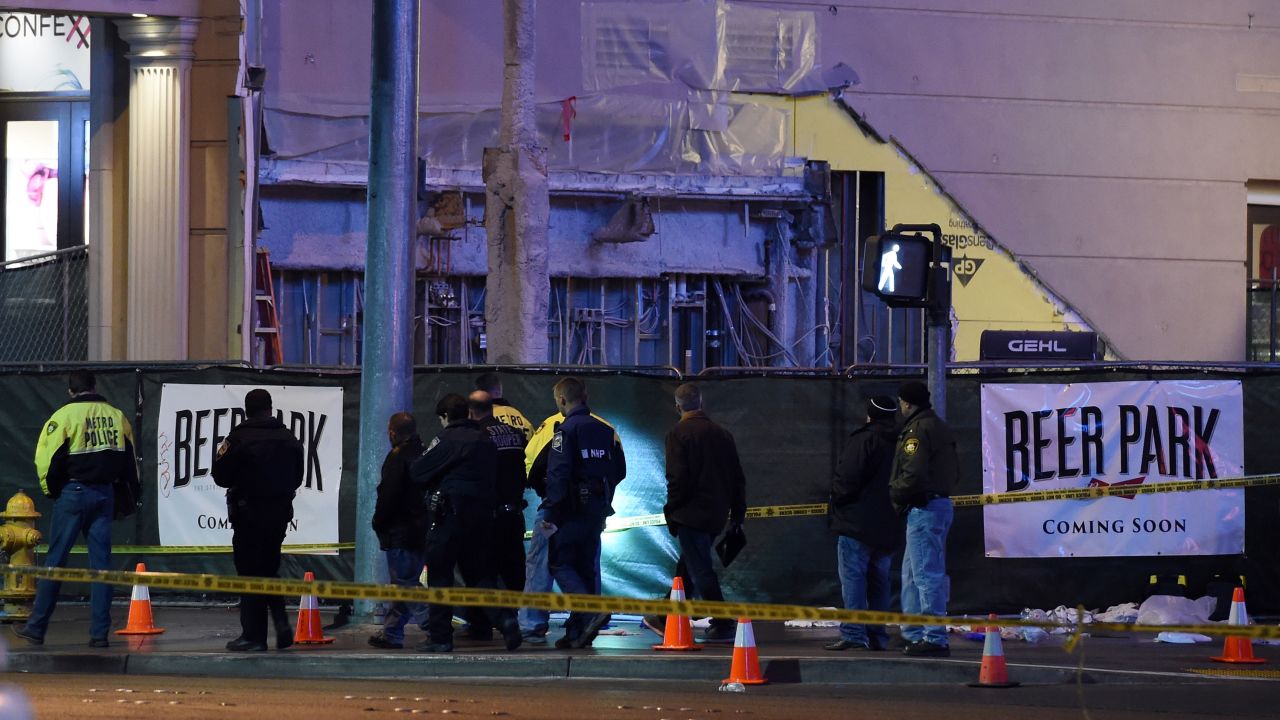 Police investigate the crash site on December 20. Witnesses said the woman was driving down Las Vegas Boulevard before her car jumped onto the sidewalk and started striking pedestrians.