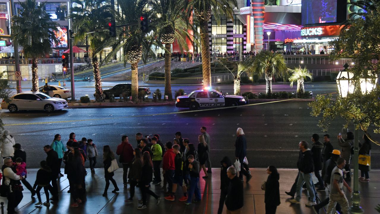Pedestrians walk down the Las Vegas Strip after police closed it to traffic on December 20.