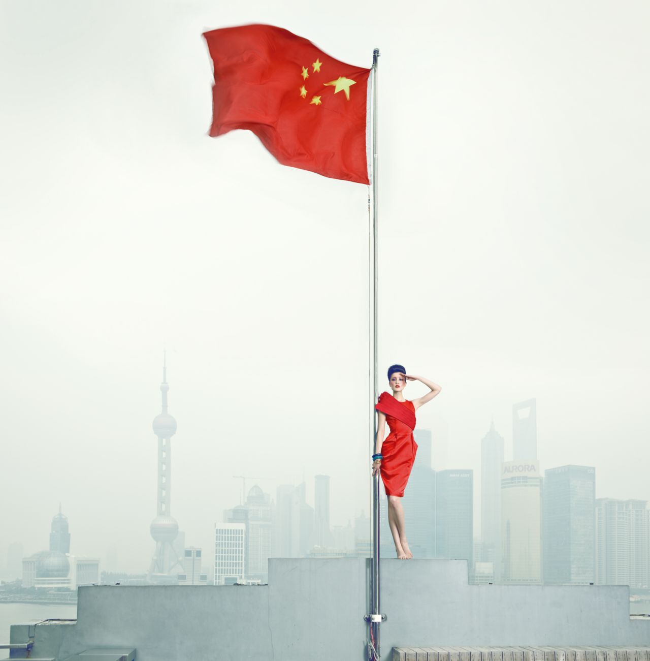 This photo is part of the "Long live the Motherland" series that appeared in Vogue in 2010. The Shanghai skyline appears in the background.