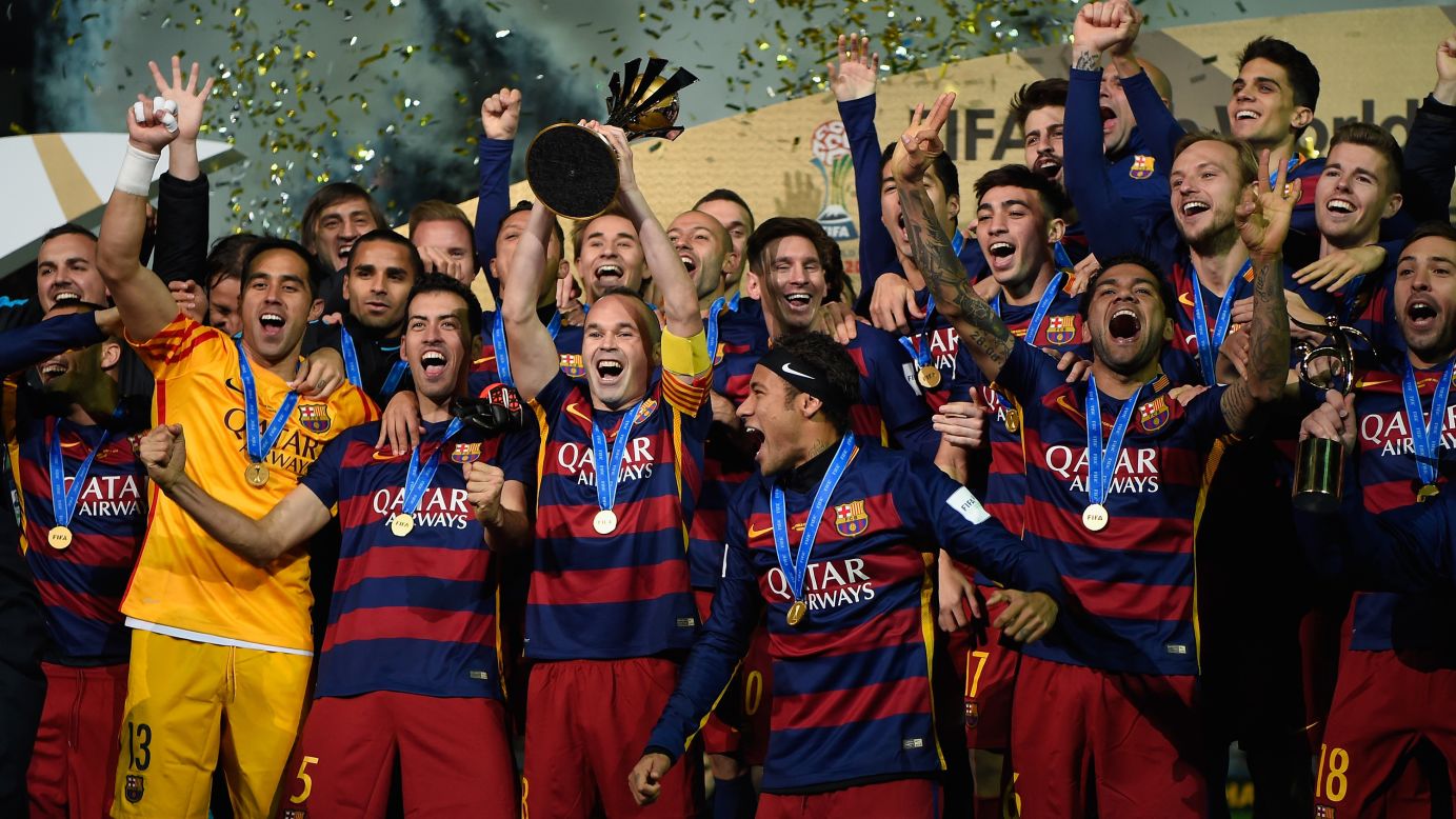 Members of FC Barcelona lift the Winner's Trophy after their victory in the FIFA Club World Cup Japan 2015 Final against River Plate at International Stadium Yokohama in Japan on Sunday, December 20. 